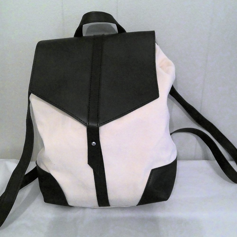 Duex Lux cream and black vegan leather
